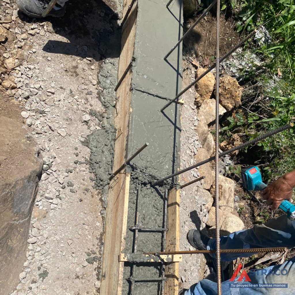 Concrete pouring into strip foundation with steel reinforcement for residential construction in Alto Boquete, Panama